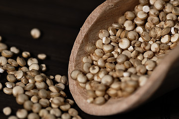 Image showing Quinoa and a wooden spatula.