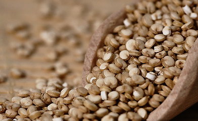 Image showing Quinoa and a wooden spatula.