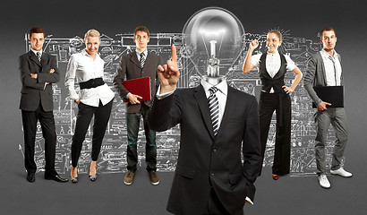 Image showing Business Team With Lamp Head