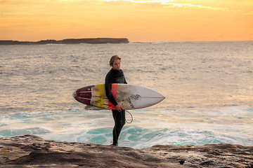 Image showing Surfer at sunrise