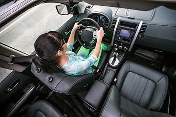 Image showing Woman behind the wheel of a car.