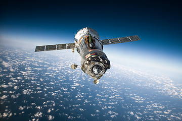 Image showing Spacecraft Soyuz over the planet earth