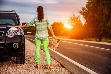 Image showing Woman with an empty tank of gas