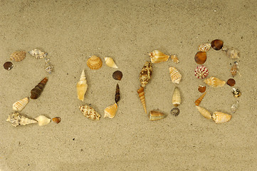 Image showing 2008 written with shells