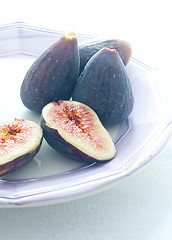 Image showing Group of colored figs on the colorful background