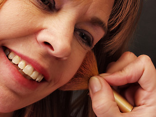 Image showing Applying Blush, smile