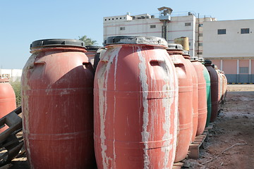 Image showing Old empty plastic drums_5737