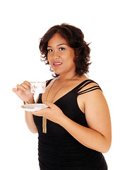 Image showing Pretty young woman drinking coffee.