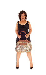 Image showing Mixed raced woman holding her purse.