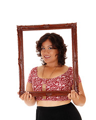 Image showing Lovely woman holding picture frame.