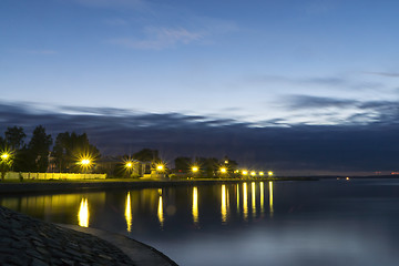 Image showing Illuminated city lake quay