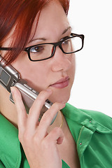 Image showing Redheaded girl talking on a mobile phone