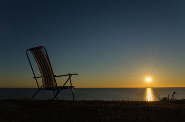 Image showing Chair by the setting sun