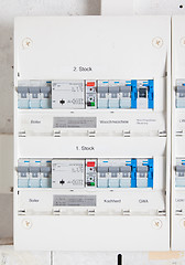 Image showing Old german fusebox, with blue buttons