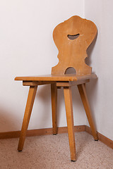 Image showing Old wooden chair at the room corner of old house, Switzerland