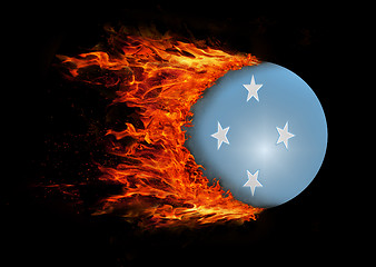 Image showing Flag with a trail of fire - Micronesia