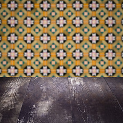 Image showing Wood table top and blur vintage ceramic tile pattern wall