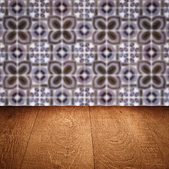 Image showing Wood table top and blur vintage ceramic tile pattern wall