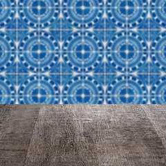 Image showing Wood table top and blur vintage ceramic tile pattern wall