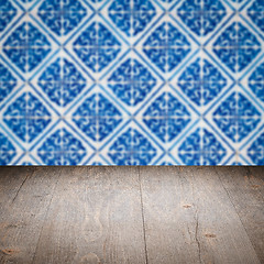 Image showing Wood table top and blur vintage ceramic tile pattern wall