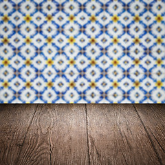 Image showing Wood table top and blur vintage ceramic tile pattern wall