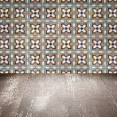 Image showing Wood table top and blur vintage ceramic tile pattern wall