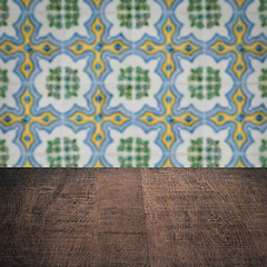 Image showing Wood table top and blur vintage ceramic tile pattern wall