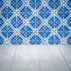 Image showing Wood table top and blur vintage ceramic tile pattern wall