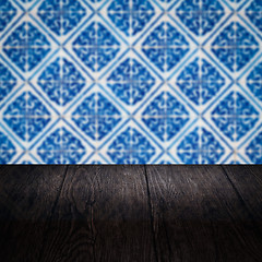 Image showing Wood table top and blur vintage ceramic tile pattern wall