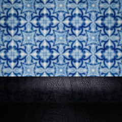 Image showing Wood table top and blur vintage ceramic tile pattern wall