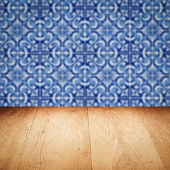 Image showing Wood table top and blur vintage ceramic tile pattern wall