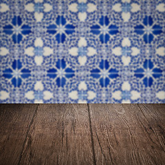 Image showing Wood table top and blur vintage ceramic tile pattern wall