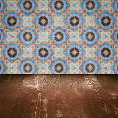 Image showing Wood table top and blur vintage ceramic tile pattern wall