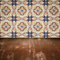 Image showing Wood table top and blur vintage ceramic tile pattern wall