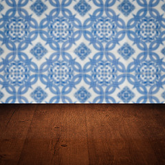 Image showing Wood table top and blur vintage ceramic tile pattern wall