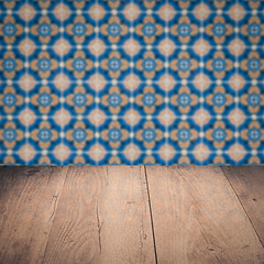 Image showing Wood table top and blur vintage ceramic tile pattern wall