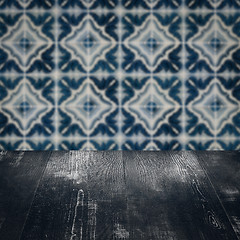 Image showing Wood table top and blur vintage ceramic tile pattern wall