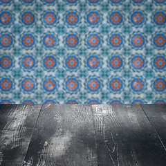 Image showing Wood table top and blur vintage ceramic tile pattern wall