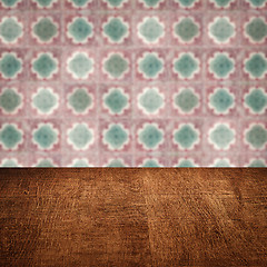 Image showing Wood table top and blur vintage ceramic tile pattern wall