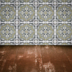 Image showing Wood table top and blur vintage ceramic tile pattern wall