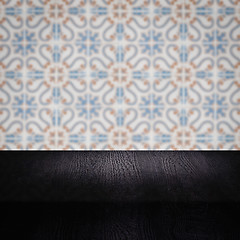 Image showing Wood table top and blur vintage ceramic tile pattern wall