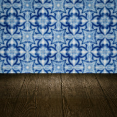 Image showing Wood table top and blur vintage ceramic tile pattern wall