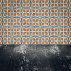 Image showing Wood table top and blur vintage ceramic tile pattern wall