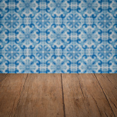 Image showing Wood table top and blur vintage ceramic tile pattern wall