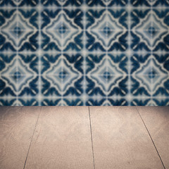 Image showing Wood table top and blur vintage ceramic tile pattern wall