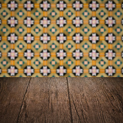 Image showing Wood table top and blur vintage ceramic tile pattern wall