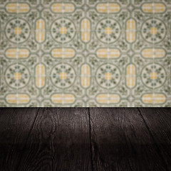 Image showing Wood table top and blur vintage ceramic tile pattern wall