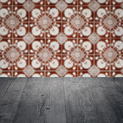 Image showing Wood table top and blur vintage ceramic tile pattern wall