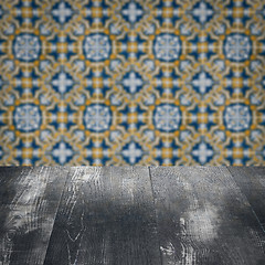 Image showing Wood table top and blur vintage ceramic tile pattern wall