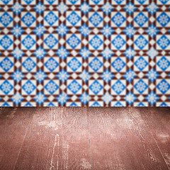 Image showing Wood table top and blur vintage ceramic tile pattern wall